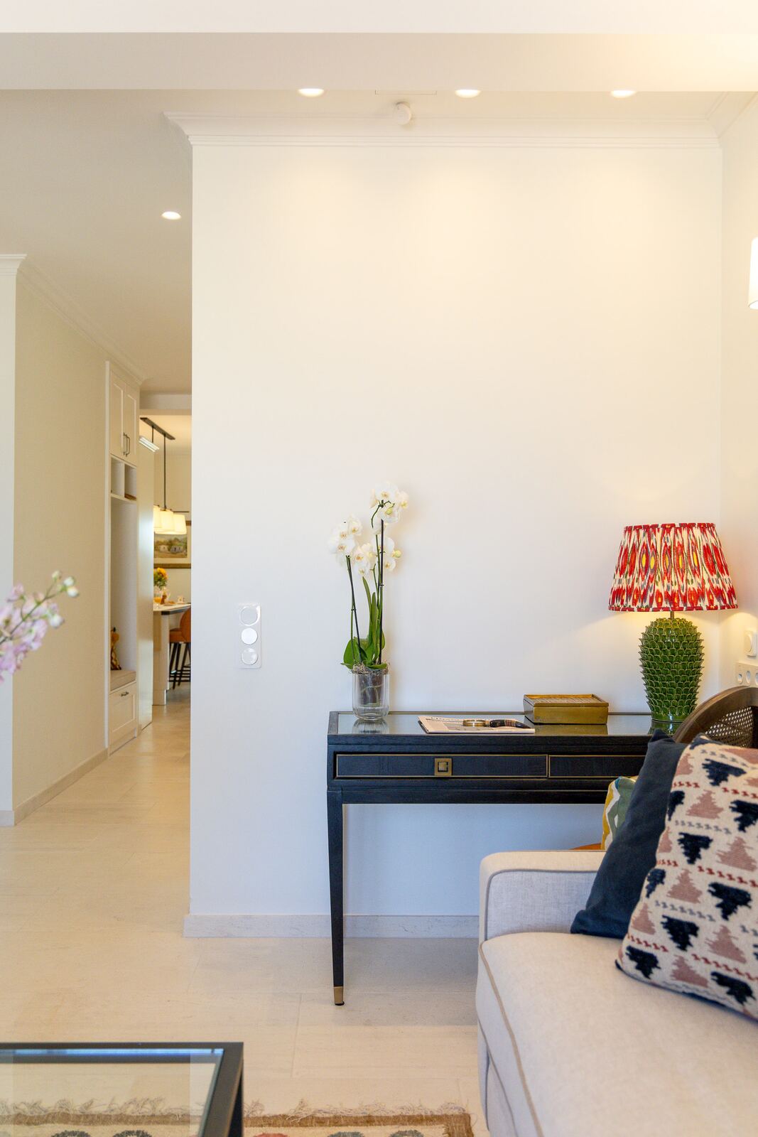Hall console with orchid, looking through to the kitchen