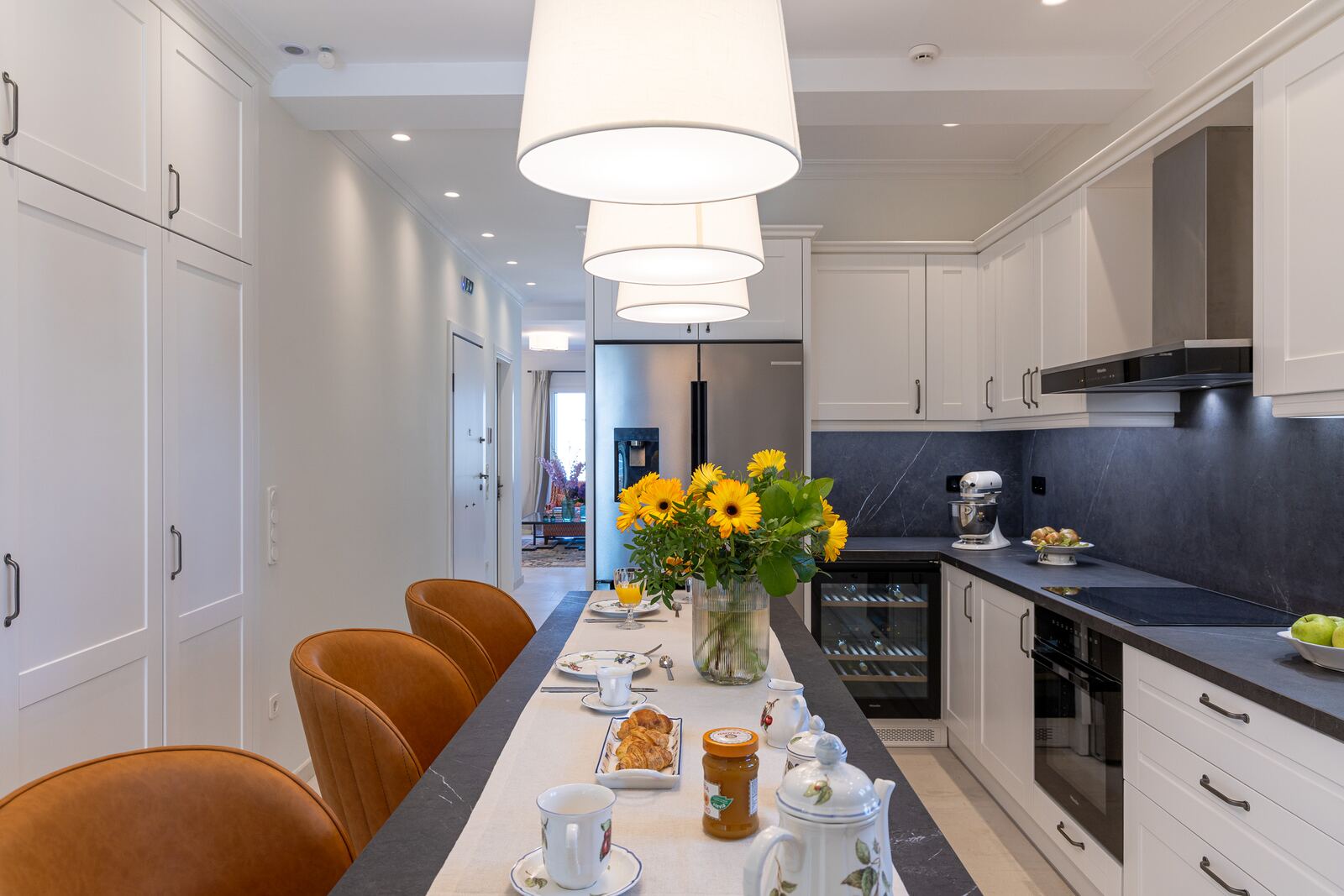 Kitchen island and fridge-freezer with stone worktops