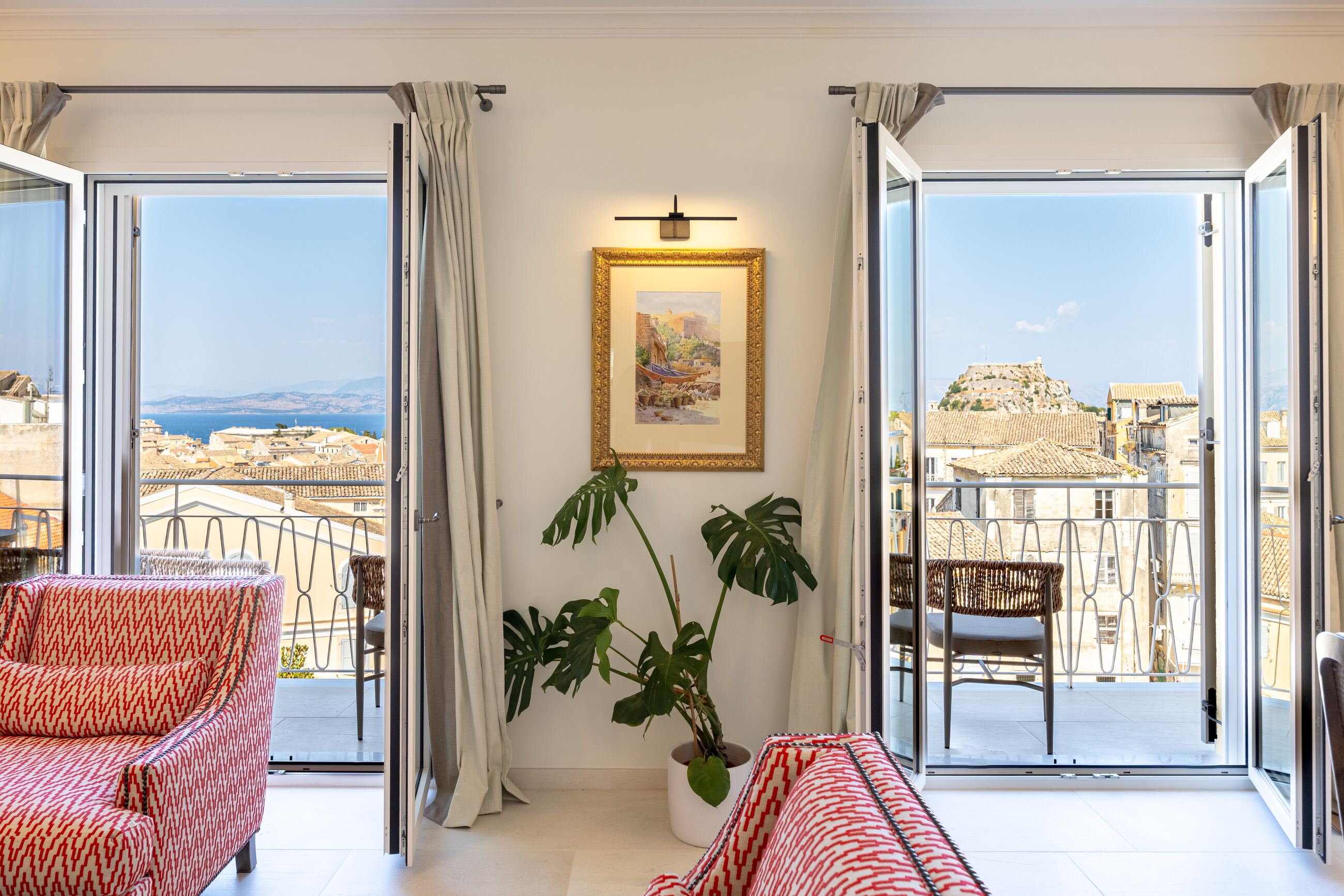 Living room with both sets of balcony doors thrown open to the Old Town