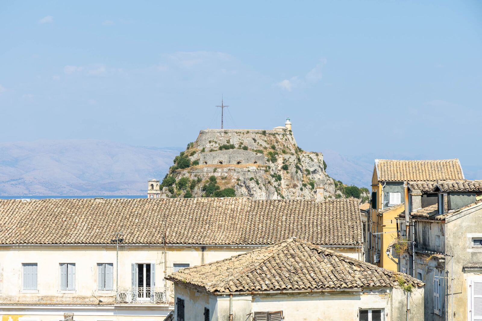 The Old Fortress on its rock seen over the Old Town by day